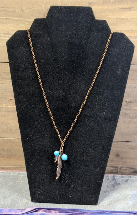 Turquoise and Howlite Necklace with Feather Charm